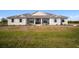 Charming single-story home featuring a covered front porch and well-maintained landscaping at 3319 Gulf City Rd, Ruskin, FL 33570