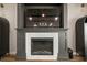 Contemporary fireplace with modern design, built-in features, and a mounted television above at 3319 Gulf City Rd, Ruskin, FL 33570