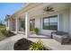 Welcoming front porch with double doors, stylish light fixture, and decorative potted plants at 3319 Gulf City Rd, Ruskin, FL 33570