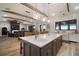 Spacious open kitchen with large island, sink, and eat-at bar with stainless steel appliances at 3319 Gulf City Rd, Ruskin, FL 33570