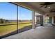 This screened in lanai provides beautiful views of the lake and backyard at 3319 Gulf City Rd, Ruskin, FL 33570