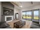 Spacious living room with fireplace and large sliding glass doors that show the outdoor scenery at 3319 Gulf City Rd, Ruskin, FL 33570