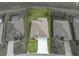 Drone view of the home showcasing the roof, driveway, and surrounding landscape with neighboring houses at 34714 Heavenly Ln, Dade City, FL 33525