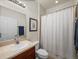 Bathroom with vanity, toilet, shower with curtain at 34714 Heavenly Ln, Dade City, FL 33525