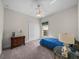 Cozy bedroom with closet, window, and accent furniture at 34714 Heavenly Ln, Dade City, FL 33525