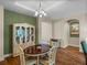 Bright dining room features hutch, hardwood floors and natural light at 34714 Heavenly Ln, Dade City, FL 33525