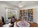 Office with a large window, a ceiling fan, and built-in bookshelves at 34714 Heavenly Ln, Dade City, FL 33525