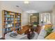 Spacious living room with dining area, built-in bookcase, and hardwood floors at 34714 Heavenly Ln, Dade City, FL 33525