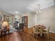 A cozy living area with hardwood floors, comfortable seating and a dining area for relaxed living at 34714 Heavenly Ln, Dade City, FL 33525