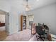Office space featuring a desk, chair, shelving, and a bright window at 34714 Heavenly Ln, Dade City, FL 33525