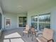 Inviting screened porch with outdoor seating; perfect for enjoying the fresh air at 34714 Heavenly Ln, Dade City, FL 33525