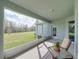 Relaxing screened porch with view of expansive backyard and an outdoor seating area at 34714 Heavenly Ln, Dade City, FL 33525
