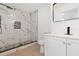 Modern bathroom featuring a walk-in shower with stylish tile and a sleek vanity at 36343 Ionno Ct, Zephyrhills, FL 33541