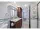 This bathroom features a granite countertop and updated sink at 387 S Mcmullen Booth Rd # 16, Clearwater, FL 33759