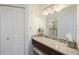 Bathroom vanity with a mirror, drawers, and a stool in a well-lit bathroom at 387 S Mcmullen Booth Rd # 16, Clearwater, FL 33759
