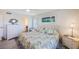 Comfortable bedroom with a ceiling fan, light-colored walls, and serene decor accents at 387 S Mcmullen Booth Rd # 16, Clearwater, FL 33759