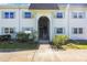 Two-story condo building with a welcoming entrance at 387 S Mcmullen Booth Rd # 16, Clearwater, FL 33759