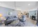 Bright living room featuring comfortable seating and an open floor plan to the kitchen and dining area at 387 S Mcmullen Booth Rd # 16, Clearwater, FL 33759