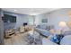 Living room with a work area and a comfortable seating arrangement at 387 S Mcmullen Booth Rd # 16, Clearwater, FL 33759