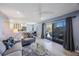 Living room with kitchen view and access to an outdoor balcony at 387 S Mcmullen Booth Rd # 16, Clearwater, FL 33759