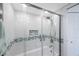 This shower features a glass door and updated showerhead at 387 S Mcmullen Booth Rd # 16, Clearwater, FL 33759