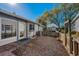 Fenced backyard featuring a combination of mulch, concrete patio and beautiful shade trees at 39650 Us Highway 19 N # 1422, Tarpon Springs, FL 34689