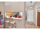 Kitchen with breakfast bar area leading into an entry way at 39650 Us Highway 19 N # 1422, Tarpon Springs, FL 34689