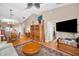 Spacious living room with hardwood floors, a ceiling fan, and open access to dining at 39650 Us Highway 19 N # 1422, Tarpon Springs, FL 34689