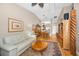 Open living space with hardwood floors, neutral walls, and a view of the dining area at 39650 Us Highway 19 N # 1422, Tarpon Springs, FL 34689