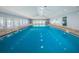 Indoor pool with vaulted ceilings, skylights, and plenty of room for swimming at 39650 Us Highway 19 N # 1422, Tarpon Springs, FL 34689