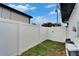 View of a securely fenced backyard with lush greenery, providing privacy and space for outdoor activities at 4118 Ramona Dr, Spring Hill, FL 34606