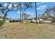 Spacious backyard featuring a pool, lush lawn, and RV parking, blending recreation with practicality at 4118 Ramona Dr, Spring Hill, FL 34606