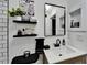 Elegant vanity with decorative shelves, contemporary fixtures, and a well-lit mirror at 4118 Ramona Dr, Spring Hill, FL 34606