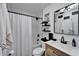 Bright bathroom with subway tile, a sleek vanity, and stylish fixtures, enhancing its appeal at 4118 Ramona Dr, Spring Hill, FL 34606