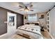 Bright bedroom with barn door, natural light, wood-look floors and neutral colored decor at 4118 Ramona Dr, Spring Hill, FL 34606