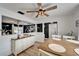 Bright dining room with wood-look floors and white furnishings, offers access to the kitchen and exterior at 4118 Ramona Dr, Spring Hill, FL 34606