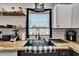 Close-up of kitchen sink with butcher block countertops, checkered towel, and a modern faucet at 4118 Ramona Dr, Spring Hill, FL 34606