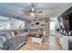 Comfortable living room with hardwood floors, a sectional sofa, and a bright open layout at 4118 Ramona Dr, Spring Hill, FL 34606