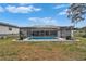 A beautifully enclosed pool area set in a well-kept backyard, creating a private oasis for relaxation and enjoyment at 4118 Ramona Dr, Spring Hill, FL 34606