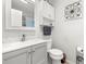 Charming bathroom with a modern gray vanity, white marble subway tile backsplash, and updated fixtures at 5227 81St N Ln # 15, St Petersburg, FL 33709