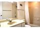Bathroom with a tub, shower, toilet, and vanity with cabinet storage at 5400 Park N St # 200, St Petersburg, FL 33709