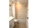 Bathroom with a tub, shower, toilet, and vanity with cabinet storage at 5400 Park N St # 200, St Petersburg, FL 33709