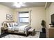 Bedroom featuring a bed, carpet, and a window with vertical blinds at 5400 Park N St # 200, St Petersburg, FL 33709