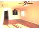 Inviting living room with a view to the kitchen and gleaming hardwood floors at 5400 Park N St # 200, St Petersburg, FL 33709