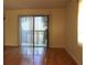Living Room featuring hardwood floors and sliding glass doors for natural light at 5400 Park N St # 200, St Petersburg, FL 33709