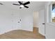Open bedroom with neutral paint features wood flooring and ceiling fan at 5426 Creeping Hammock Dr, Sarasota, FL 34231
