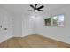 Inviting bedroom featuring wood-look flooring, a large window, and a closet at 5426 Creeping Hammock Dr, Sarasota, FL 34231