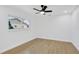 Cozy bedroom featuring natural light and sleek ceiling fan at 5426 Creeping Hammock Dr, Sarasota, FL 34231