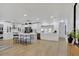 Spacious, open-concept kitchen boasts stainless steel appliances and a large center island with barstool seating at 5426 Creeping Hammock Dr, Sarasota, FL 34231