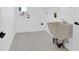 Functional laundry room featuring tile flooring, utility sink, and exterior access at 5426 Creeping Hammock Dr, Sarasota, FL 34231